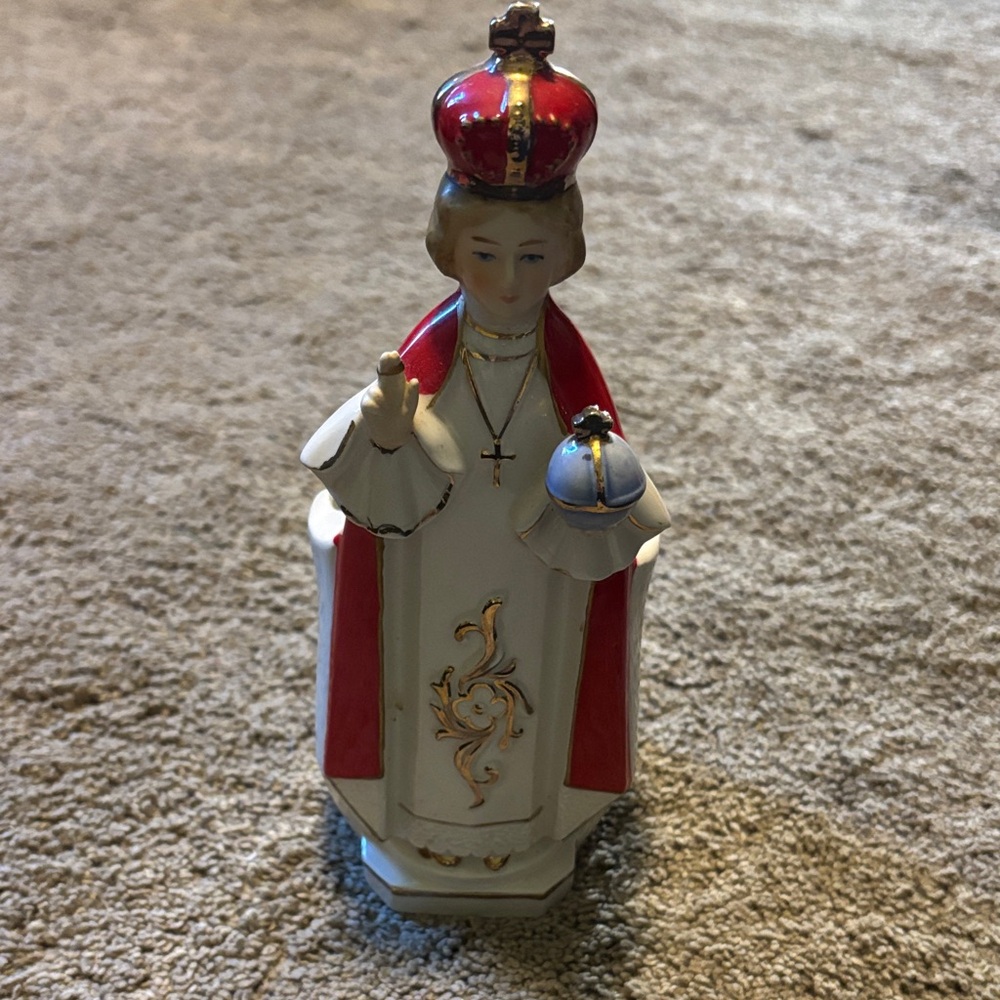 Ceramic Religious Figurine with Red and White Accents